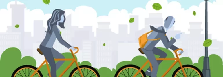 Due persone in bicicletta in un parco cittadino con foglie al vento.